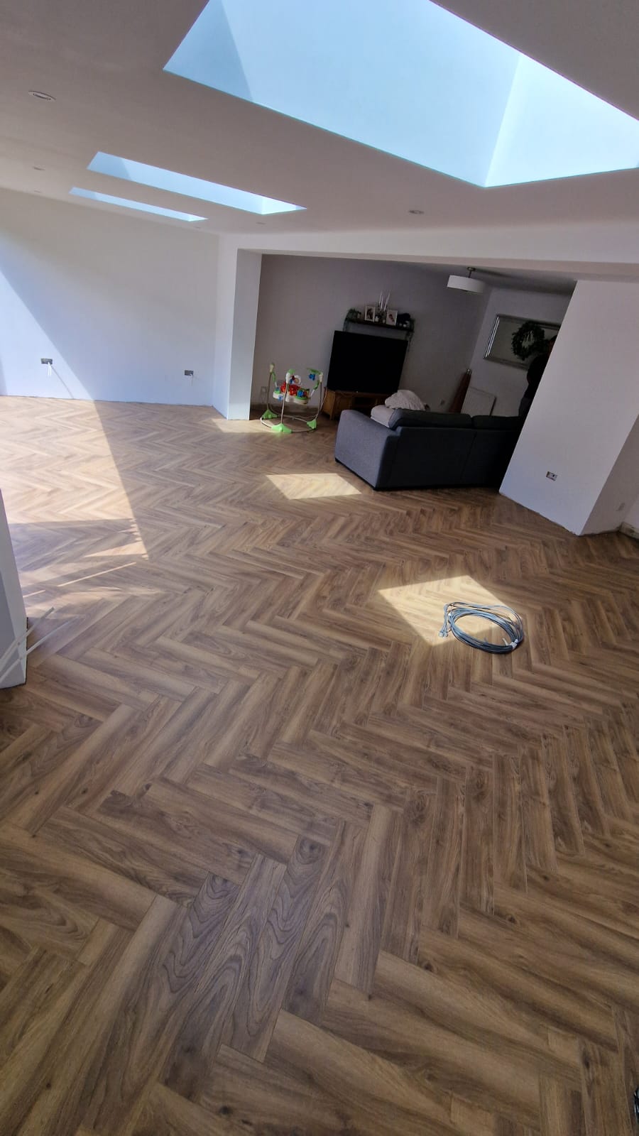Completed herringbone flooring installation